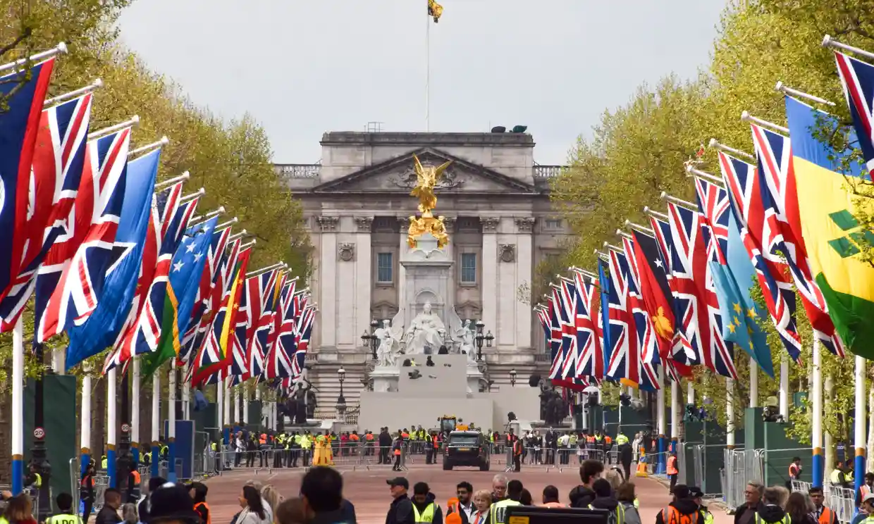 Union Jacks and flags of Commonwealth countries decorate the Mall leading to Buckingham Palace on the eve of the coronation of King Charles III. Photograph: Vuk Valcic/Zuma Press Wire/Shutterstock