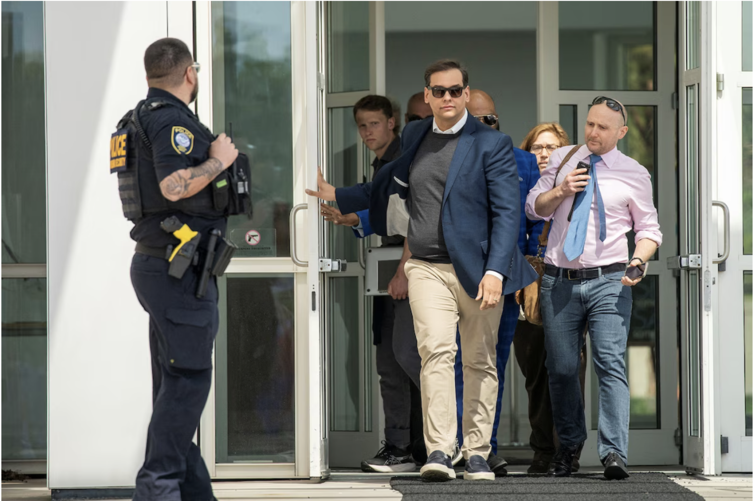 Rep. George Santos (R-N.Y.) leaves federal court in Central Islip, N.Y., on Wednesday. (Eduardo Munoz/Reuters)