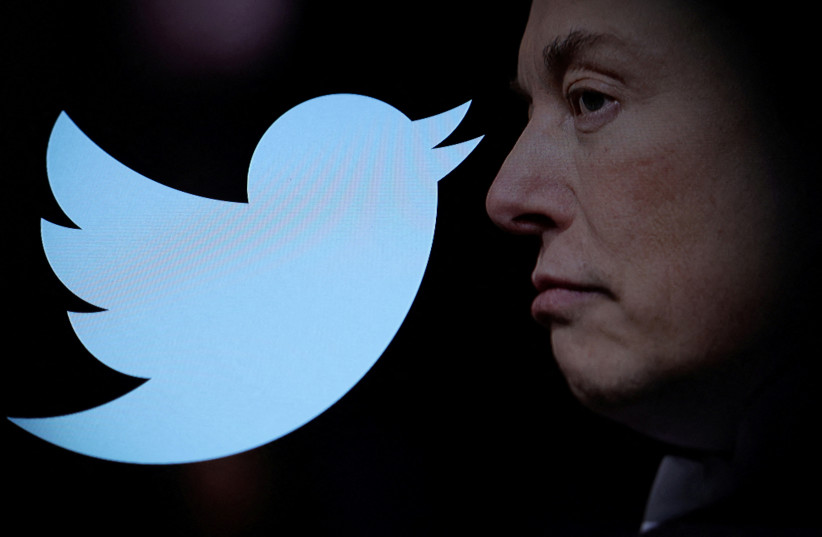 Twitter logo and a photo of Elon Musk are displayed through magnifier in this illustration taken October 27, 2022. Photo credit: REUTERS/DADO RUVIC/ILLUSTRATION
