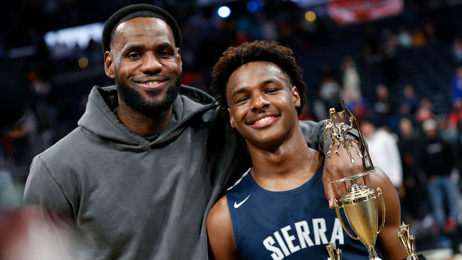 Jay LaPrete/AP LeBron James, left, poses with his son Bronny after Sierra Canyon beat Akron St. Vincent - St. Mary in a high school basketball game on December 14, 2019, in Columbus, Ohio.