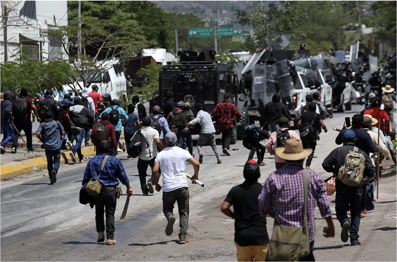  Protesters clash with state police Monday in Chilpancingo. (Jose Luis De La Cruz/EPA-EFE/Shutterstock)