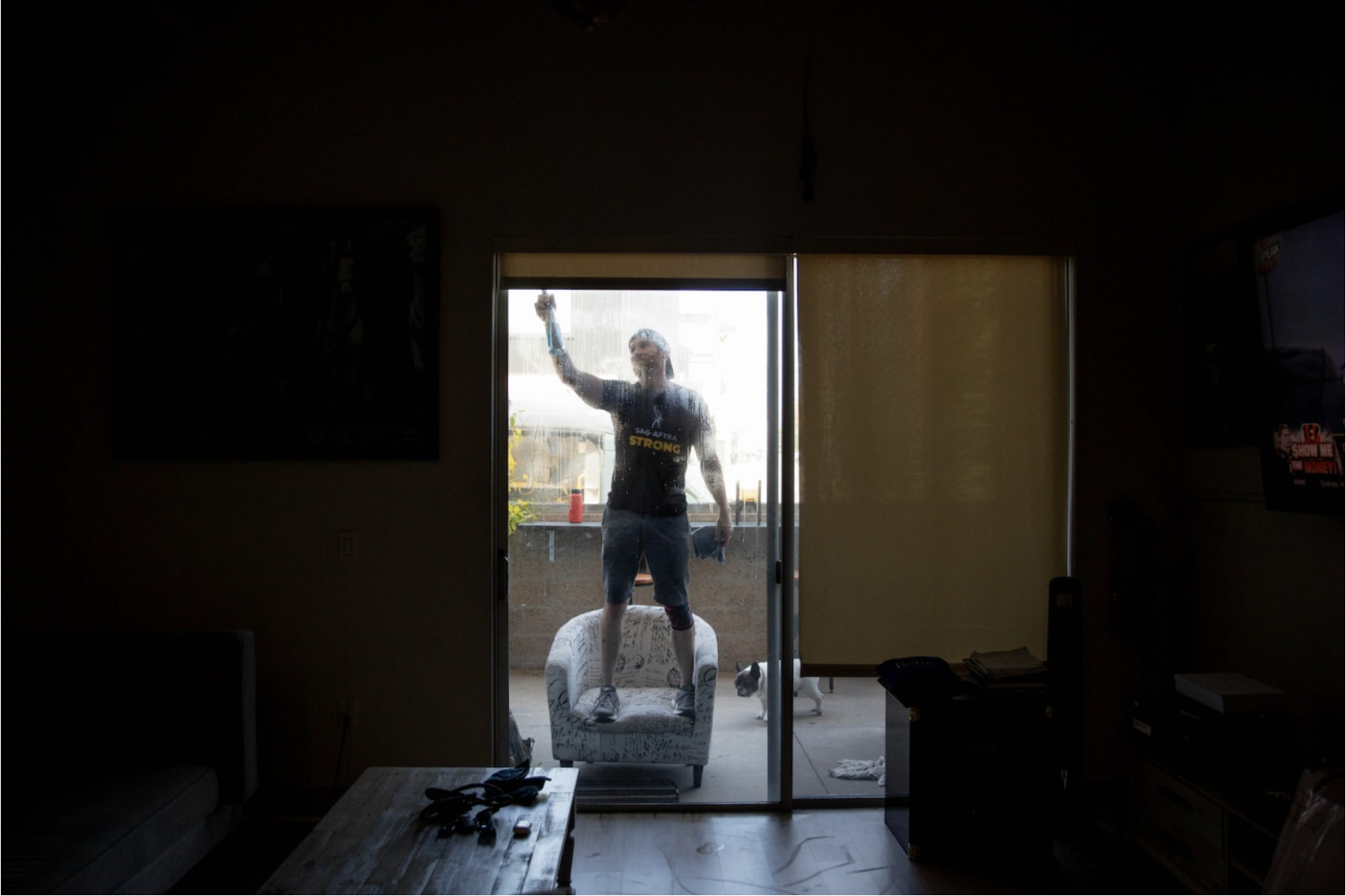 Actor Josh Hooks cleans an apartment in Venice for extra cash. (Allison Zaucha for The Washington Post)