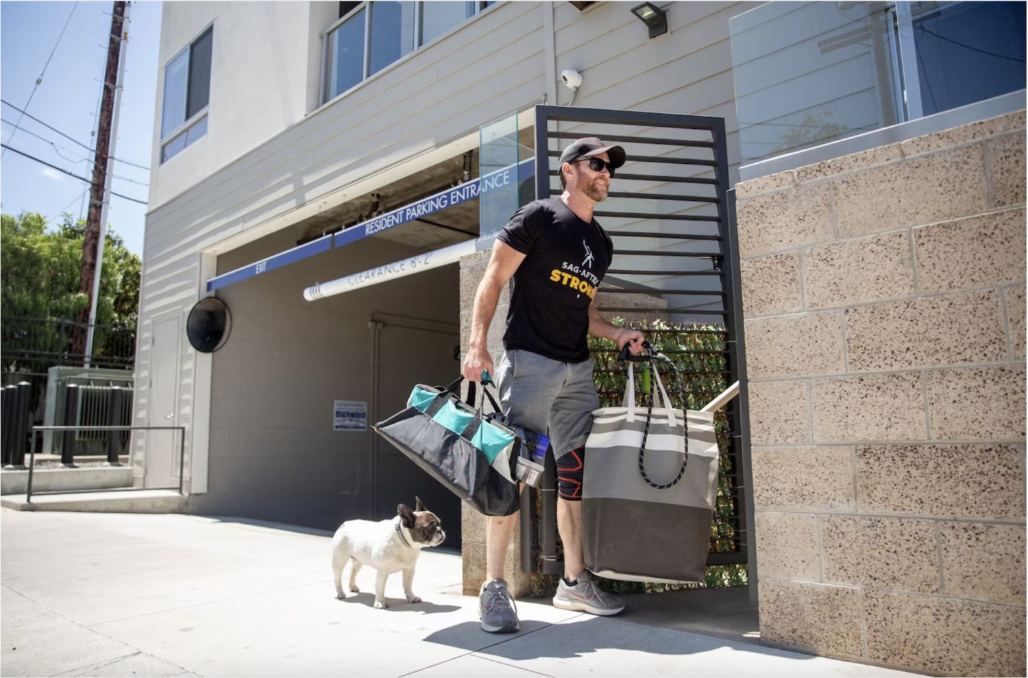 Josh Hooks and his dog arrive for a job to clean a home in Venice. (Allison Zaucha for The Washington Post)