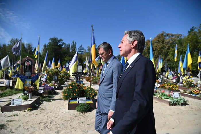 U.S. Secretary of State Antony Blinken and Ukrainian Foreign Minister Dmytro Kuleba, who wears glasses, visit a cemetery in Kyiv, Ukraine. PHOTO: UKRAINIAN MINISTRY OF FOREIGN AFFAIRS/ASSOCIATED PRESS