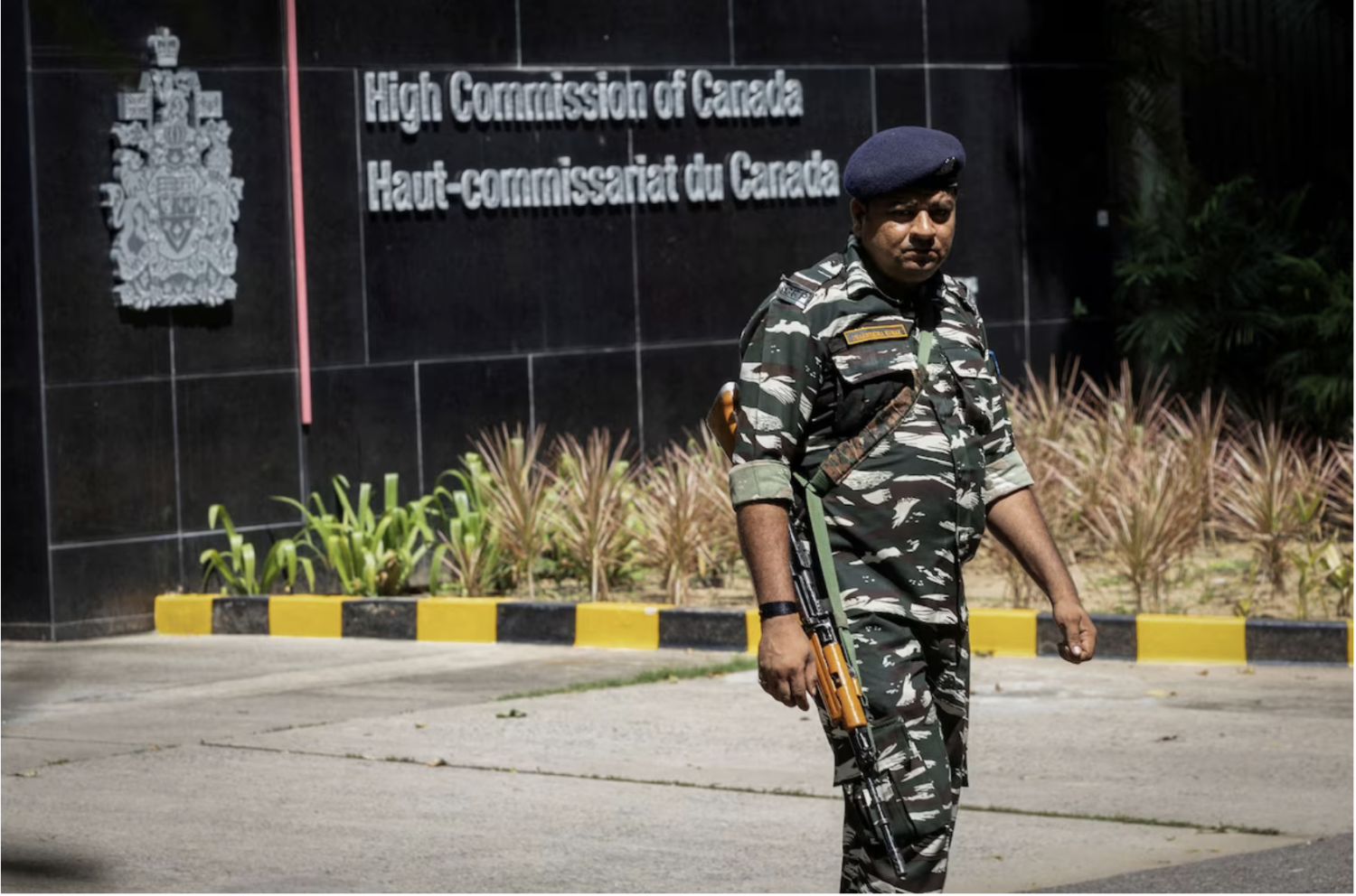 A security guard outside the Canadian High-Commission in New Delhi on Tuesday. (Adnan Abidi/Reuters)