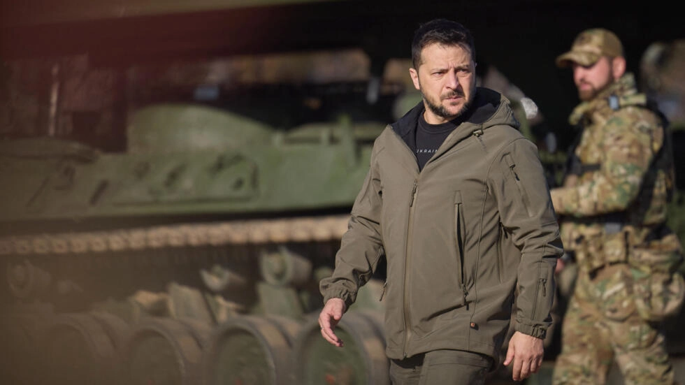 This handout photograph taken and released by the Ukrainian Presidential Press Service on November 3, 2023 shows President Volodymyr Zelensky inspecting artillery and engineering weaponry during a visit to a training at an undisclosed location in Ukraine.