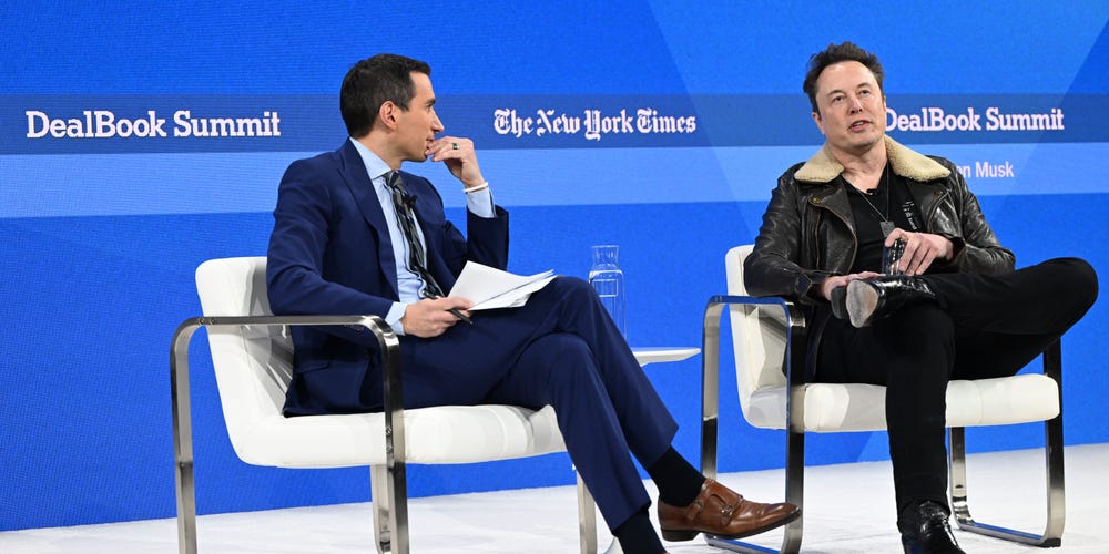 Left to right: Andrew Ross Sorkin and Elon Musk speak onstage during The New York Times DealBook Summit 2023. Slaven Vlasic/Getty Images for The New York Times