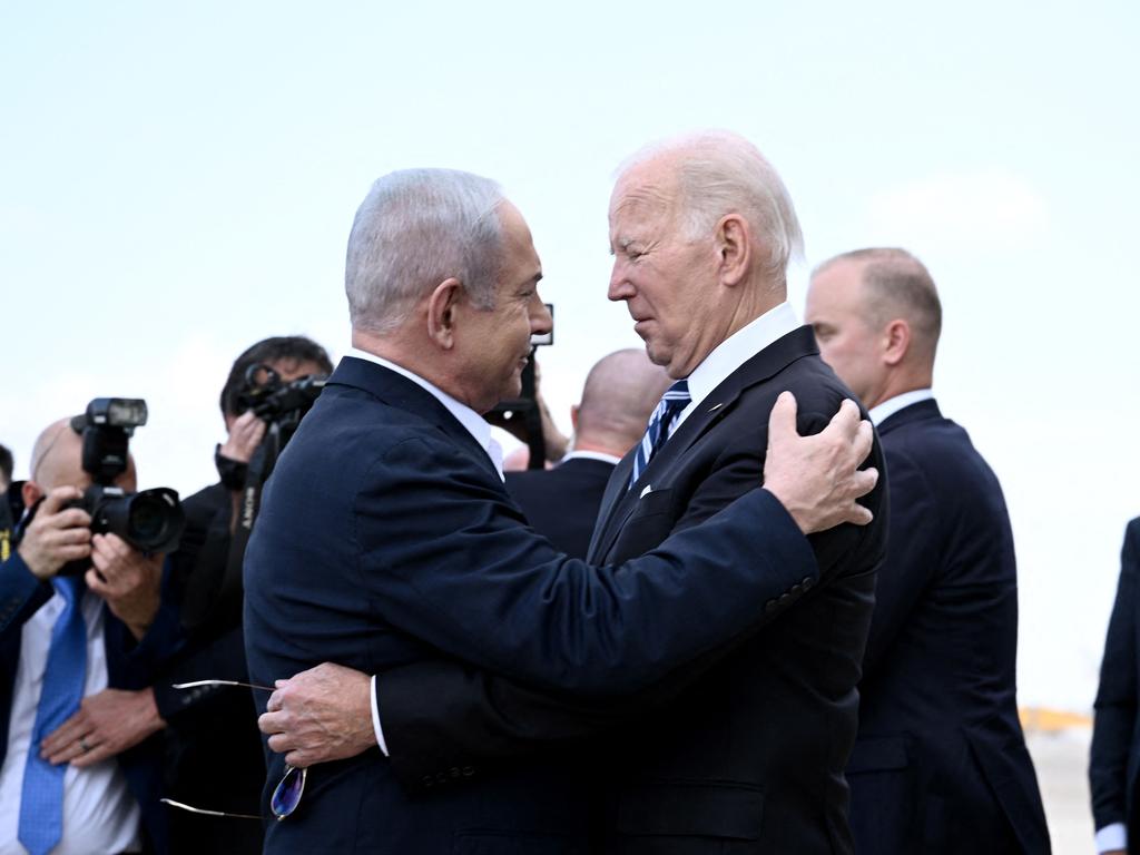 Israel Prime Minister Benjamin Netanyahu greets US President Joe Biden upon his arrival at Tel Aviv's Ben Gurion airport on October 18, 2023. Picture: Brendan SMIALOWSKI / AFP