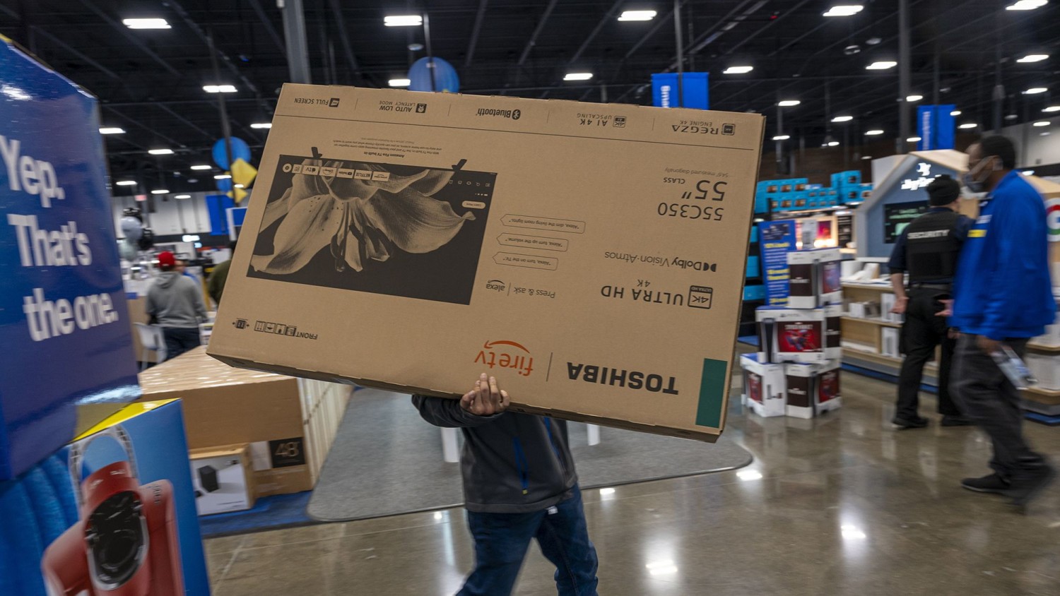 A shopper carries a Toshiba television inside a Best Buy store on Black Friday in Union City, California, US, on Friday, Nov. 24, 2023. David Paul Morris/Bloomberg/Getty Images