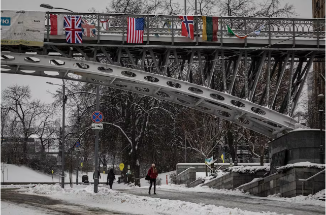 The U.S. flag hangs above a street in Kyiv on Friday. (Ed Ram for The Washington Post)