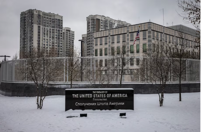 Snow covers a sign for the U.S. Embassy in Kyiv on Friday. (Ed Ram for The Washington Post)
