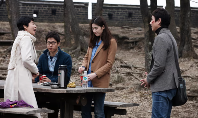 Lee (far right) as a film studies professor in Nobody’s Daughter Haewon.