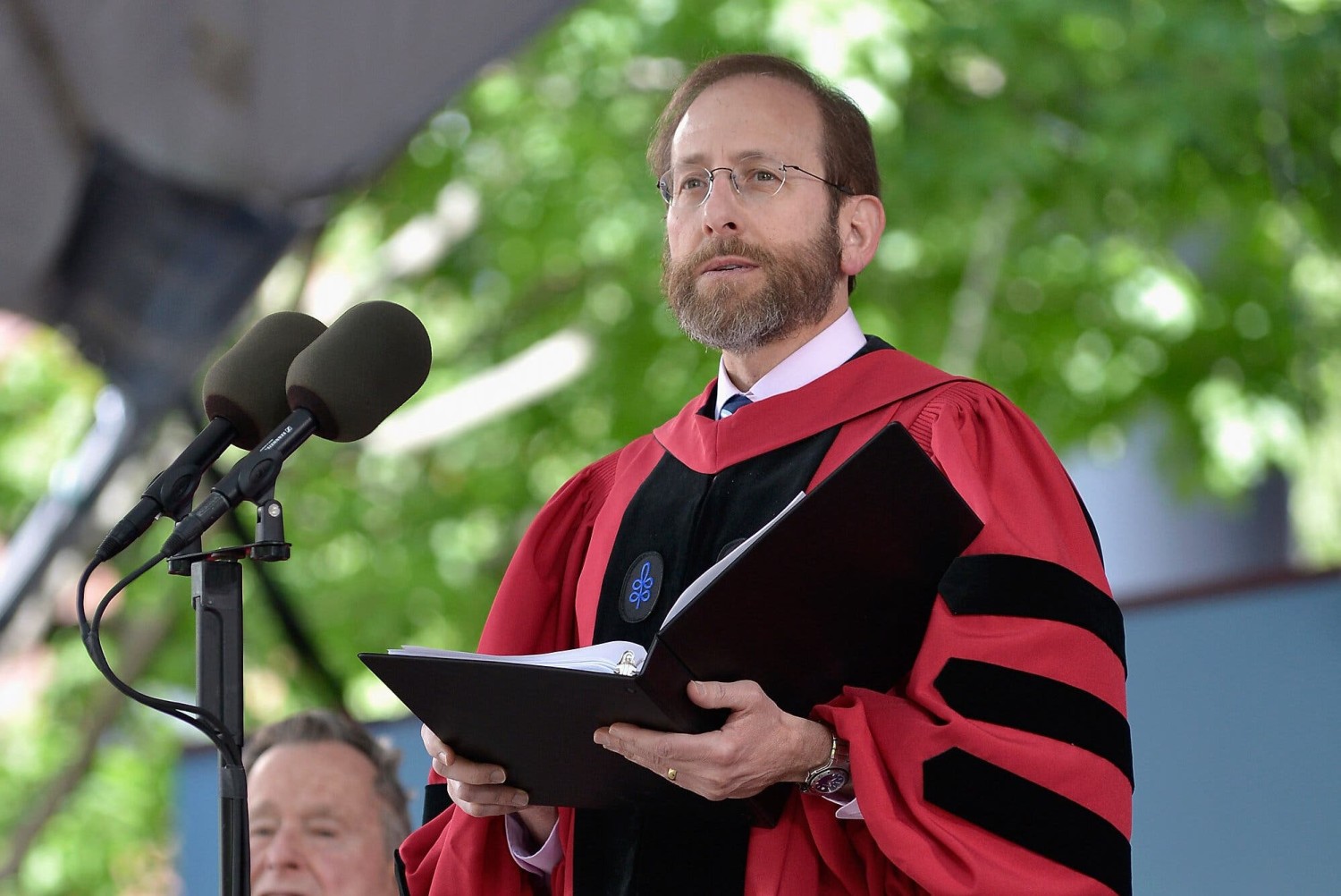 Alan M. Garber, the provost of Harvard University, delivering a commencement address in 2014. He will serve as interim president.Credit...Paul Marotta/Getty Images