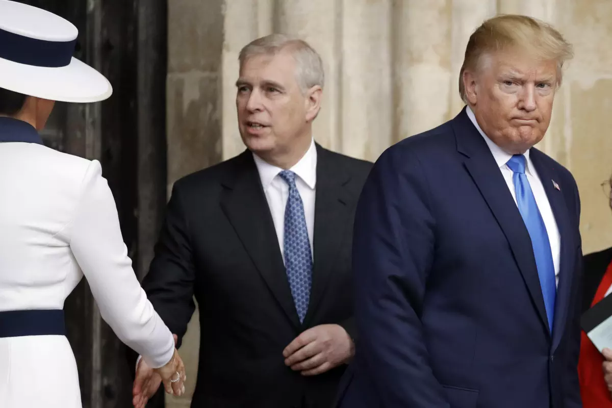 Britain’s Prince Andrew greets Melania Trump alongside then-President Trump in London in June 2019. (Matt Dunham / Associated Press)