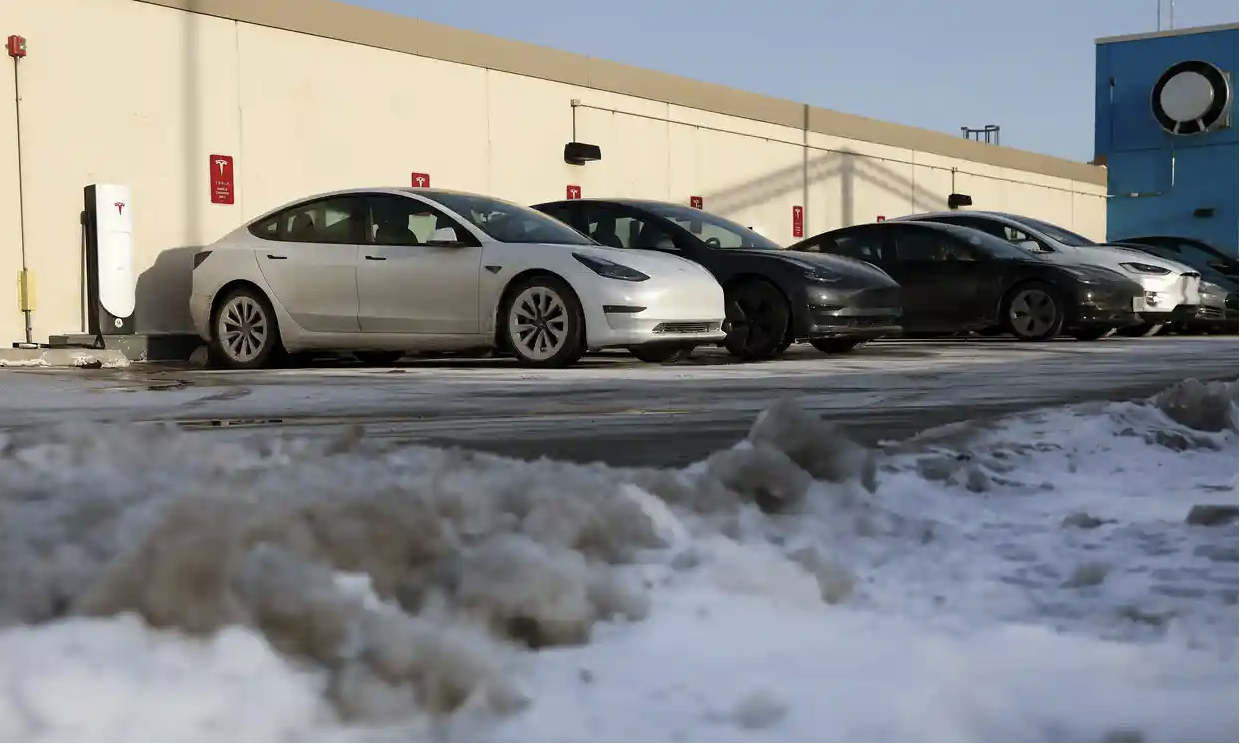Tesla vehicles charge in a parking lot in Chicago, Illinois, this week. Photograph: Kevin Dietsch/Getty Images