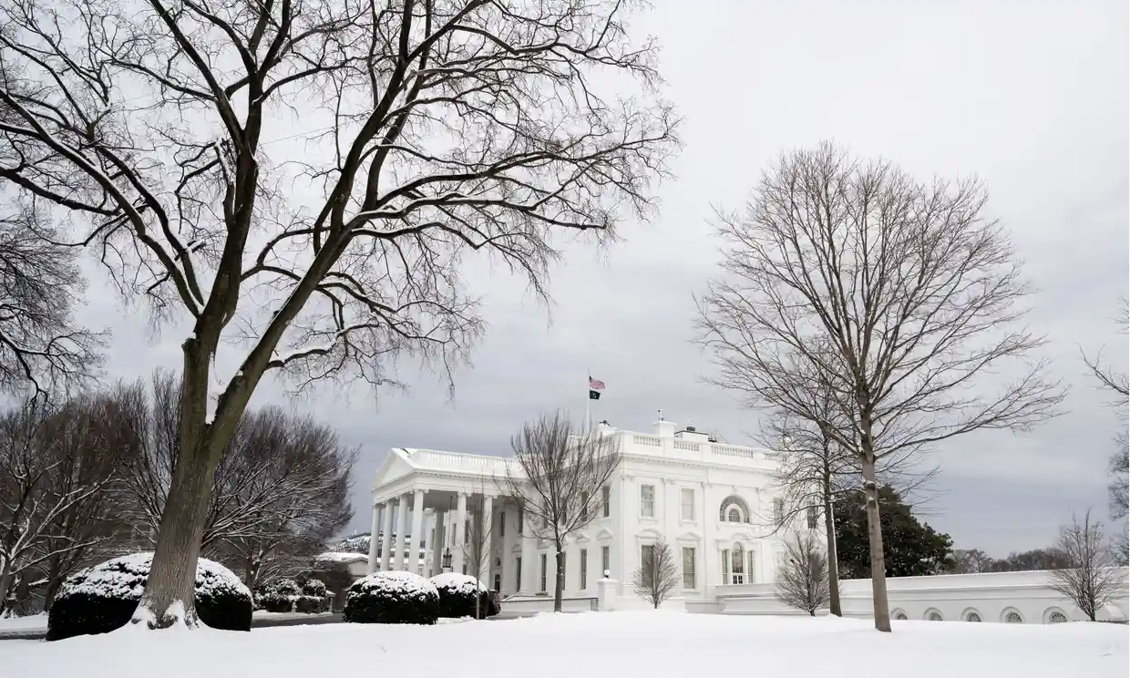 Snow blankets the White House in Washington DC. Photograph: Saul Loeb/AFP/Getty Images