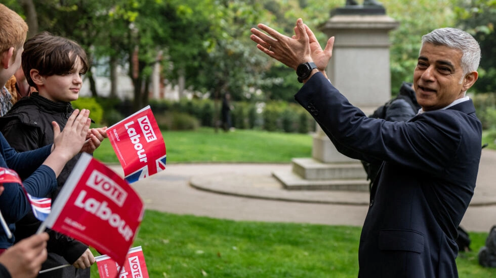 Mayor of London Sadiq Khan reacts during a photo-call with supporters the day before voters go to the polls in the London Mayoral elections in London, Britain on May 1, 2024. © Chris J Ratcliffe, Reuters