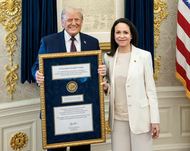 María Corina Machado presented Donald Trump with her Nobel peace prize medal on Thursday, but the Nobel’s organisers said the prize ‘cannot be revoked, shared or transferred’. Photograph: Daniel Torok/The White House/Reuters