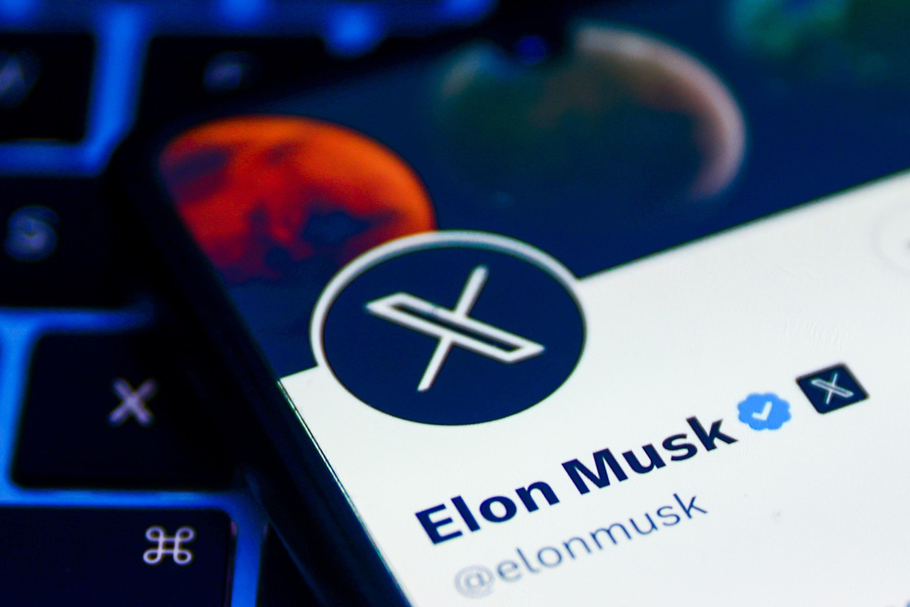 Elon Musk Twitter account with 'X' logo. NurPhoto via Getty Images
