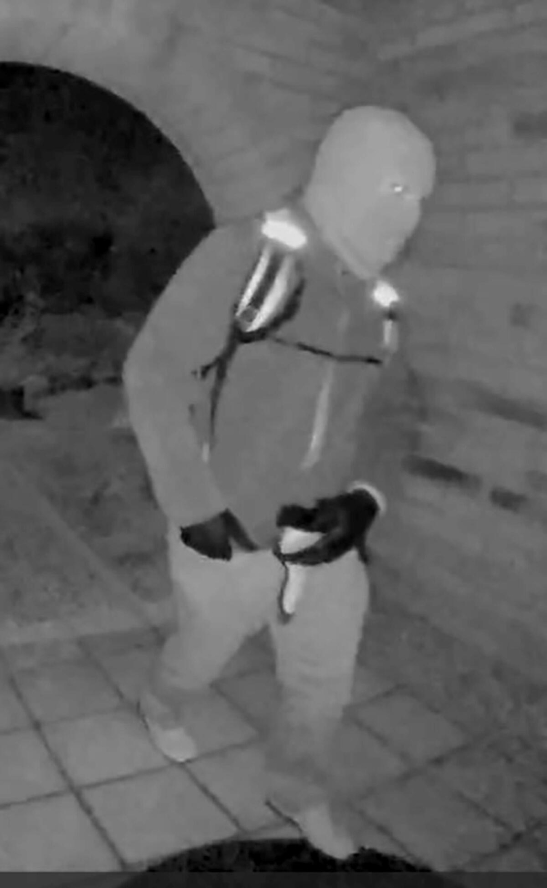 The FBI released this image showing an armed individual believed to have tampered with the camera at Nancy Guthrie’s front door the morning of her disappearance. (FBI)