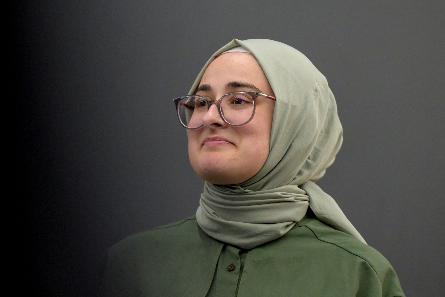 Tufts University student Rümeysa Öztürk arrives at a news conference at Boston Logan International Airport on May 10, 2025, after spending over six weeks in an immigration detention center in Louisiana. Faith Ninivaggi/Reuters