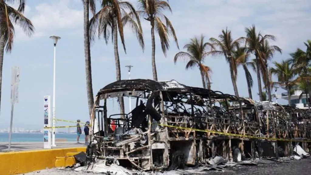 EPA / The remains of burned out vehicles can still be seen on the streets of cities in Jalisco state