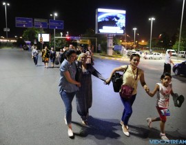 People walk away from Istanbul Ataturk airport, Turkey, following a blast June 28, 2016.