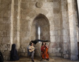 Israeli street performers play at the Jaffa Gate, in the Old City of Jerusalem on Dec. 1, 2017.