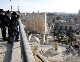 Ultra Orthodox Jews look on the Tower of David Museum, in the Old City of Jerusalem on Nov. 30, 2017.