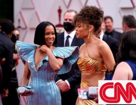 "One Night in Miami..." director Regina King, left, walks the red carpet near Andra Day. King opened the show and presented the first two awards.