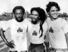Bob Marley (centre) with football player Paolo Cesar Caju (left) and singer-songwriter Chico Buarque (right) on a football field in Rio de Janeiro, Brazil, in 1980