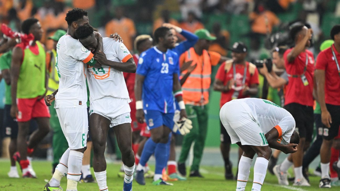 Ivory Coast's midfielder Franck Kessie consoles a distraught Oumar Diakite after Equatorial Guinea's drubbing. ISSOUF SANOGO/AFP via Getty Images
