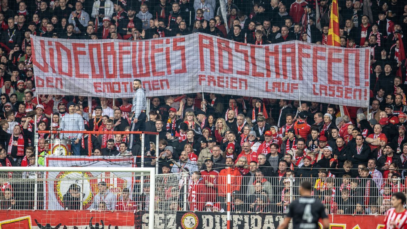 Union Berlin fans display a banner which reads 'Abolish video evidence! Let the emotions run free!' Andreas Gora/picture alliance via Getty Images