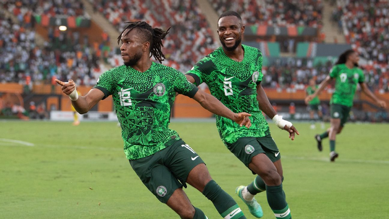 Ademola Olajide Lookman, left, celebrates with teammate Ogochukwu Frank Onyeka after scoring Nigeria's game-winning goal against Angola in AFCON on Feb. 2, 2024. Visionhaus/Getty Images